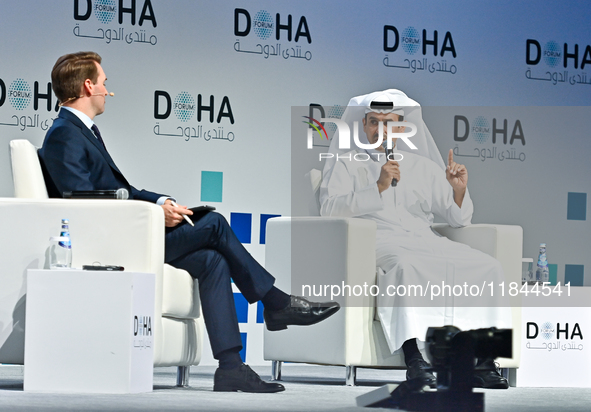 Qatar's Energy Minister and CEO of QatarEnergy, Saad Sherida al-Kaabi (R), speaks during the Doha Forum 2024 at Sheraton Grand Doha Resort &...