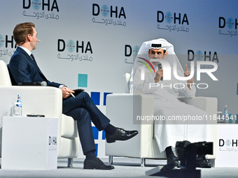 Qatar's Energy Minister and CEO of QatarEnergy, Saad Sherida al-Kaabi (R), speaks during the Doha Forum 2024 at Sheraton Grand Doha Resort &...