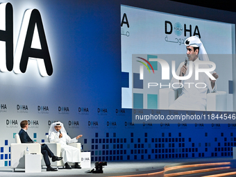 Qatar's Energy Minister and CEO of QatarEnergy, Saad Sherida al-Kaabi (R), speaks during the Doha Forum 2024 at Sheraton Grand Doha Resort &...