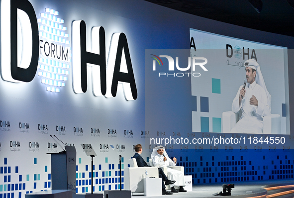 Qatar's Energy Minister and CEO of QatarEnergy, Saad Sherida al-Kaabi (R), speaks during the Doha Forum 2024 at Sheraton Grand Doha Resort &...