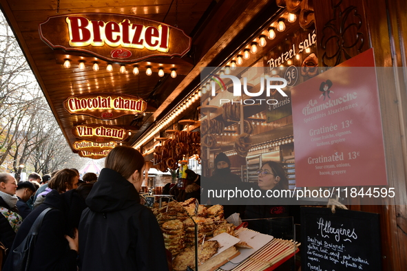 People are at the Christmas market on Place Carnot in Lyon, France, on December 7, 2024. 