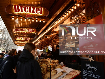 People are at the Christmas market on Place Carnot in Lyon, France, on December 7, 2024. (