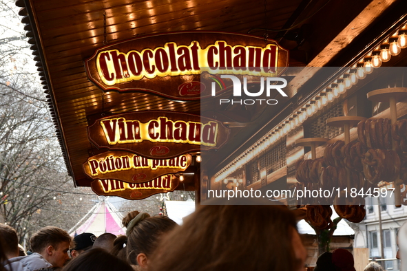 People are at the Christmas market on Place Carnot in Lyon, France, on December 7, 2024. 