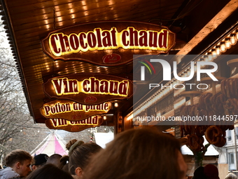 People are at the Christmas market on Place Carnot in Lyon, France, on December 7, 2024. (