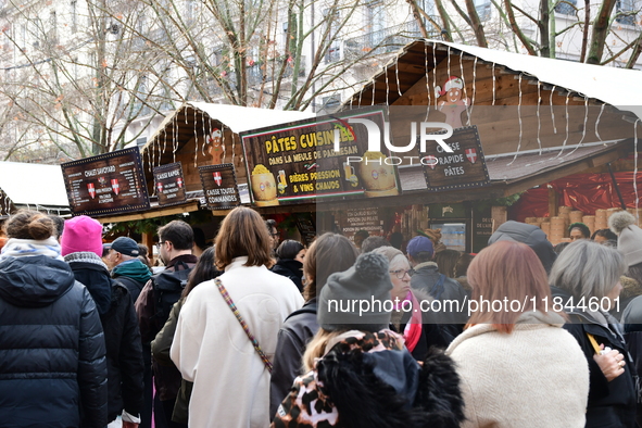 People are at the Christmas market on Place Carnot in Lyon, France, on December 7, 2024. 