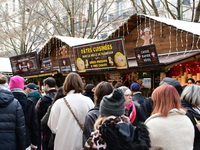 People are at the Christmas market on Place Carnot in Lyon, France, on December 7, 2024. (