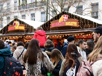 People are at the Christmas market on Place Carnot in Lyon, France, on December 7, 2024. (