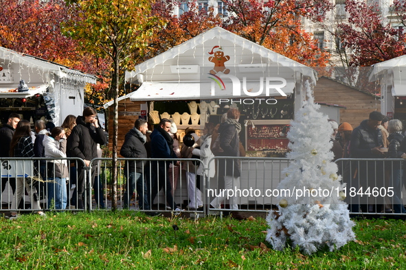 People are at the Christmas market on Place Carnot in Lyon, France, on December 7, 2024. 