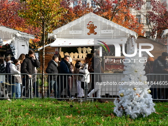 People are at the Christmas market on Place Carnot in Lyon, France, on December 7, 2024. (