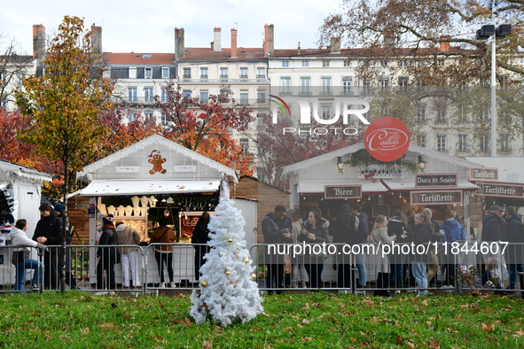 People are at the Christmas market on Place Carnot in Lyon, France, on December 7, 2024. 