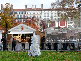 People are at the Christmas market on Place Carnot in Lyon, France, on December 7, 2024. (