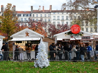 People are at the Christmas market on Place Carnot in Lyon, France, on December 7, 2024. (