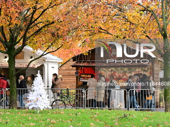 People are at the Christmas market on Place Carnot in Lyon, France, on December 7, 2024. (