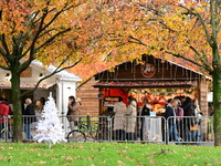 People are at the Christmas market on Place Carnot in Lyon, France, on December 7, 2024. (