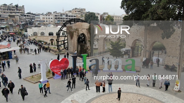 Celebrations continue in the city of Hama, where Syrians gather at Al-Assi Square to take commemorative photos and express their joy over th...