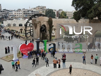 Celebrations continue in the city of Hama, where Syrians gather at Al-Assi Square to take commemorative photos and express their joy over th...