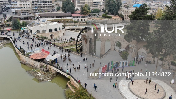 Celebrations continue in the city of Hama, where Syrians gather at Al-Assi Square to take commemorative photos and express their joy over th...