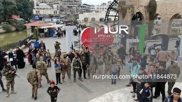 Celebrations continue in the city of Hama, where Syrians gather at Al-Assi Square to take commemorative photos and express their joy over th...