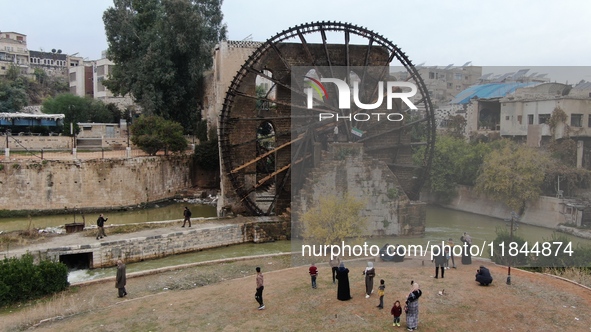 Celebrations continue in the city of Hama, where Syrians gather at Al-Assi Square to take commemorative photos and express their joy over th...