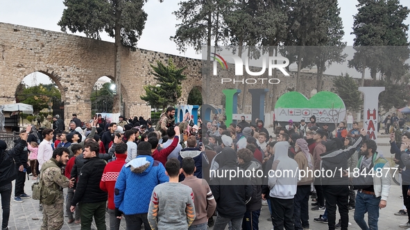 Celebrations continue in the city of Hama, where Syrians gather at Al-Assi Square to take commemorative photos and express their joy over th...