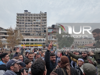 Celebrations continue in the city of Hama, where Syrians gather at Al-Assi Square to take commemorative photos and express their joy over th...