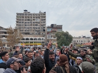 Celebrations continue in the city of Hama, where Syrians gather at Al-Assi Square to take commemorative photos and express their joy over th...