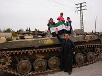 Celebrations continue in the city of Hama, where Syrians gather at Al-Assi Square to take commemorative photos and express their joy over th...