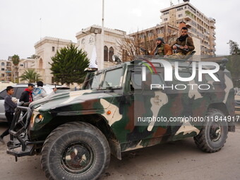 Celebrations continue in the city of Hama, where Syrians gather at Al-Assi Square to take commemorative photos and express their joy over th...