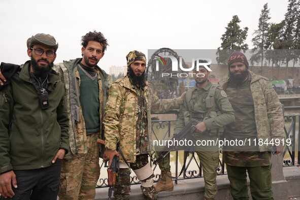 Celebrations continue in the city of Hama, where Syrians gather at Al-Assi Square to take commemorative photos and express their joy over th...