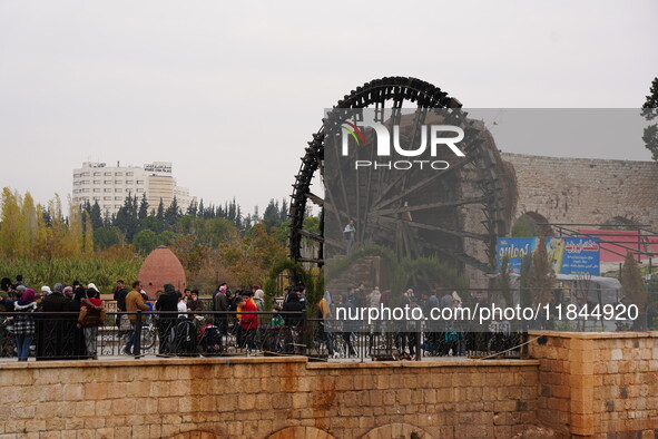 Celebrations continue in the city of Hama, where Syrians gather at Al-Assi Square to take commemorative photos and express their joy over th...