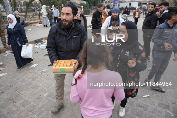 Celebrations continue in the city of Hama, where Syrians gather at Al-Assi Square to take commemorative photos and express their joy over th...