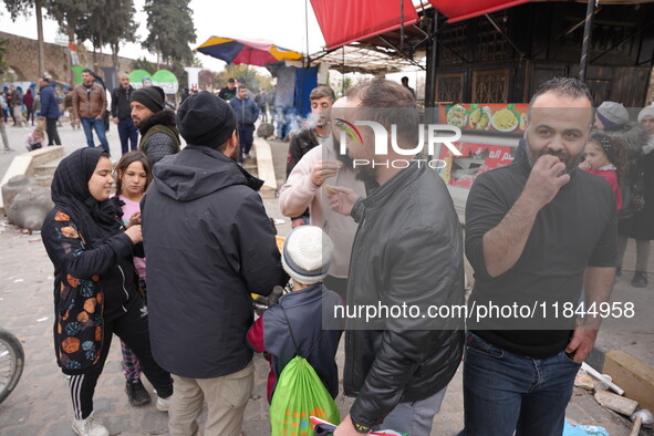 Celebrations continue in the city of Hama, where Syrians gather at Al-Assi Square to take commemorative photos and express their joy over th...