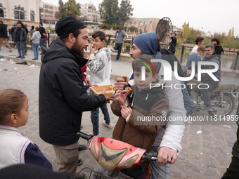 Celebrations continue in the city of Hama, where Syrians gather at Al-Assi Square to take commemorative photos and express their joy over th...