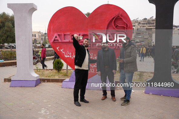 Celebrations continue in the city of Hama, where Syrians gather at Al-Assi Square to take commemorative photos and express their joy over th...