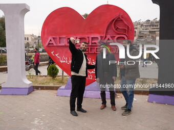 Celebrations continue in the city of Hama, where Syrians gather at Al-Assi Square to take commemorative photos and express their joy over th...