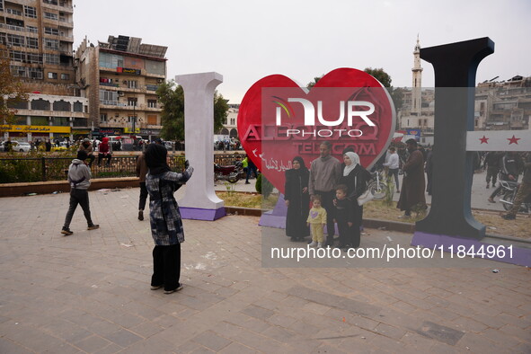 Celebrations continue in the city of Hama, where Syrians gather at Al-Assi Square to take commemorative photos and express their joy over th...