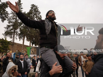 Celebrations continue in the city of Hama, where Syrians gather at Al-Assi Square to take commemorative photos and express their joy over th...