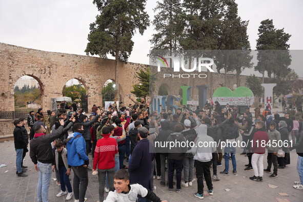 Celebrations continue in the city of Hama, where Syrians gather at Al-Assi Square to take commemorative photos and express their joy over th...