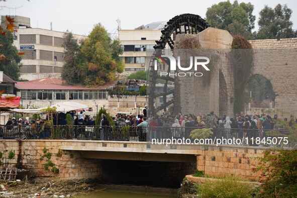 Celebrations continue in the city of Hama, where Syrians gather at Al-Assi Square to take commemorative photos and express their joy over th...