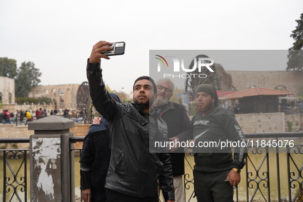 Celebrations continue in the city of Hama, where Syrians gather at Al-Assi Square to take commemorative photos and express their joy over th...