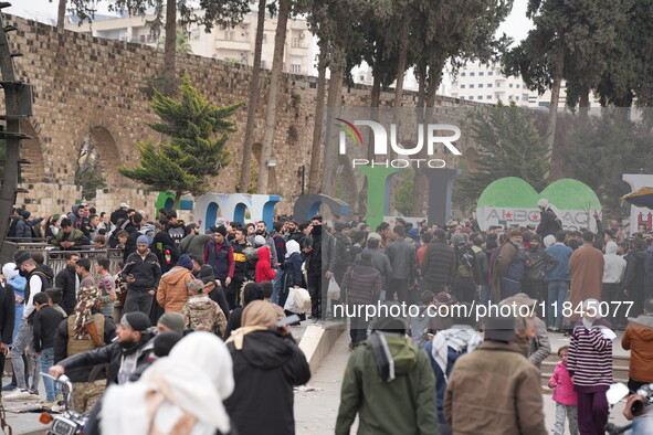 Celebrations continue in the city of Hama, where Syrians gather at Al-Assi Square to take commemorative photos and express their joy over th...