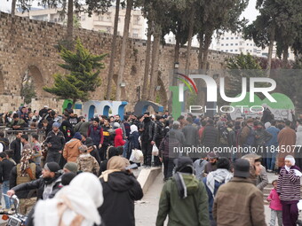 Celebrations continue in the city of Hama, where Syrians gather at Al-Assi Square to take commemorative photos and express their joy over th...