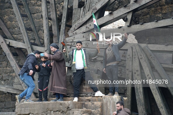 Celebrations continue in the city of Hama, where Syrians gather at Al-Assi Square to take commemorative photos and express their joy over th...