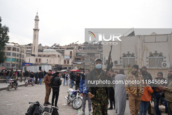 Celebrations continue in the city of Hama, where Syrians gather at Al-Assi Square to take commemorative photos and express their joy over th...