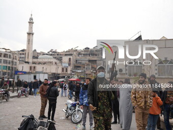 Celebrations continue in the city of Hama, where Syrians gather at Al-Assi Square to take commemorative photos and express their joy over th...