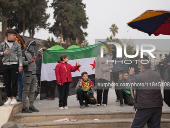 Celebrations continue in the city of Hama, where Syrians gather at Al-Assi Square to take commemorative photos and express their joy over th...