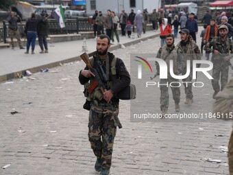 Celebrations continue in the city of Hama, where Syrians gather at Al-Assi Square to take commemorative photos and express their joy over th...