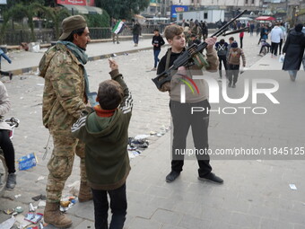 Celebrations continue in the city of Hama, where Syrians gather at Al-Assi Square to take commemorative photos and express their joy over th...