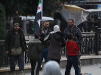 Celebrations continue in the city of Hama, where Syrians gather at Al-Assi Square to take commemorative photos and express their joy over th...