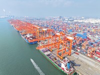 Container cargoes from Qinzhou Automated Container Terminal of Beiwan Port are sold overseas by rail-sea intermodal train on the Western Lan...